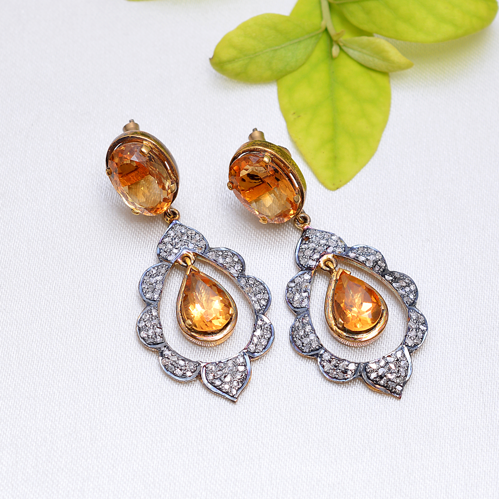 Pair of earrings with vibrant Citrine & uncut diamonds set in gold plated silver