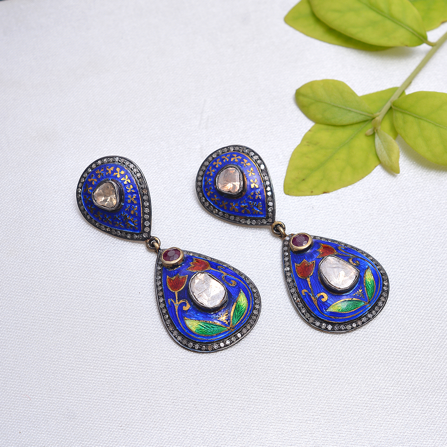 Silver enamel pair of earrings with diamond polki's & rubies in silver