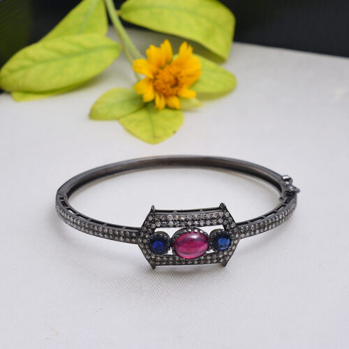 Ruby, blue sapphire & uncut diamonds Victorian bangle in silver 
