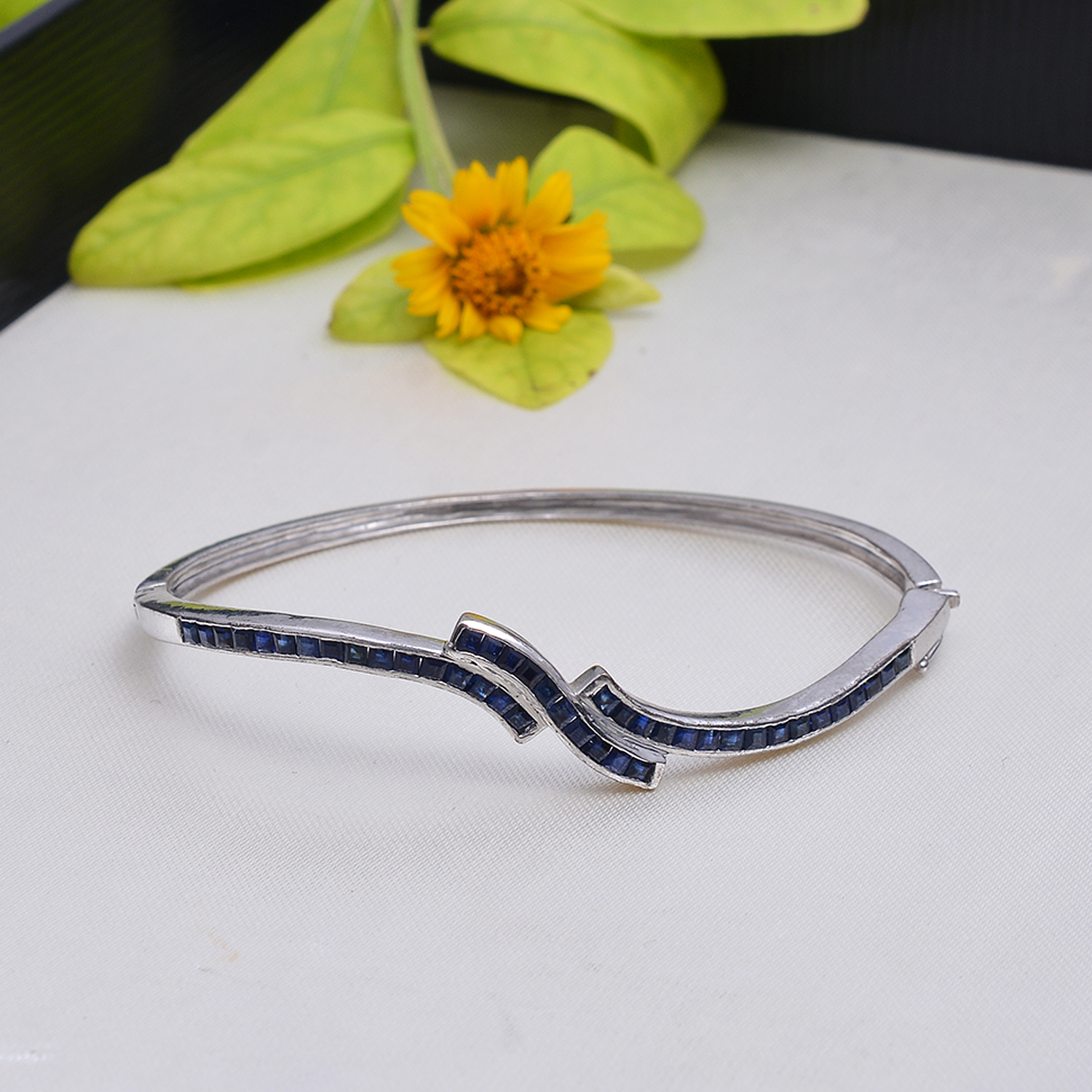 Square blue sapphire bangle in silver