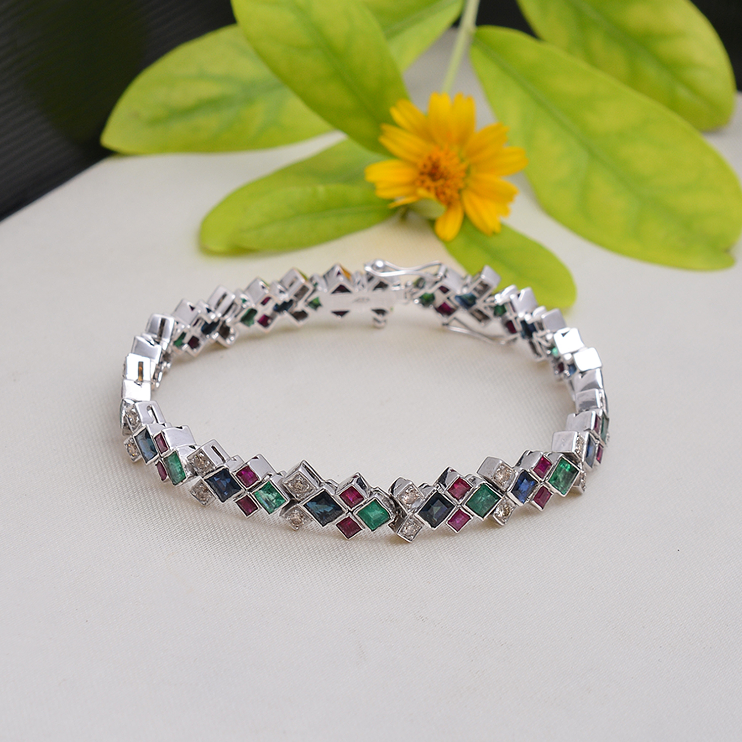 Square Emeralds, rubies, blue sapphire & diamonds in 18 ct white gold