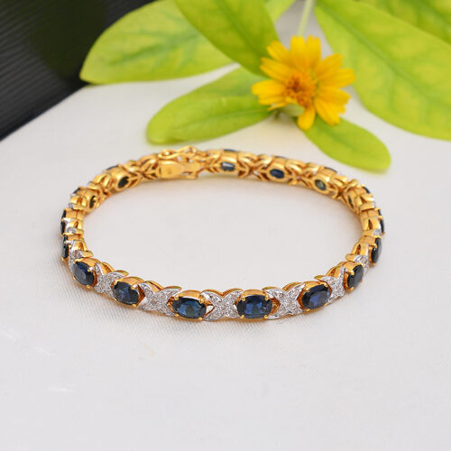 Oval blue sapphire & diamonds in 18ct yellow gold