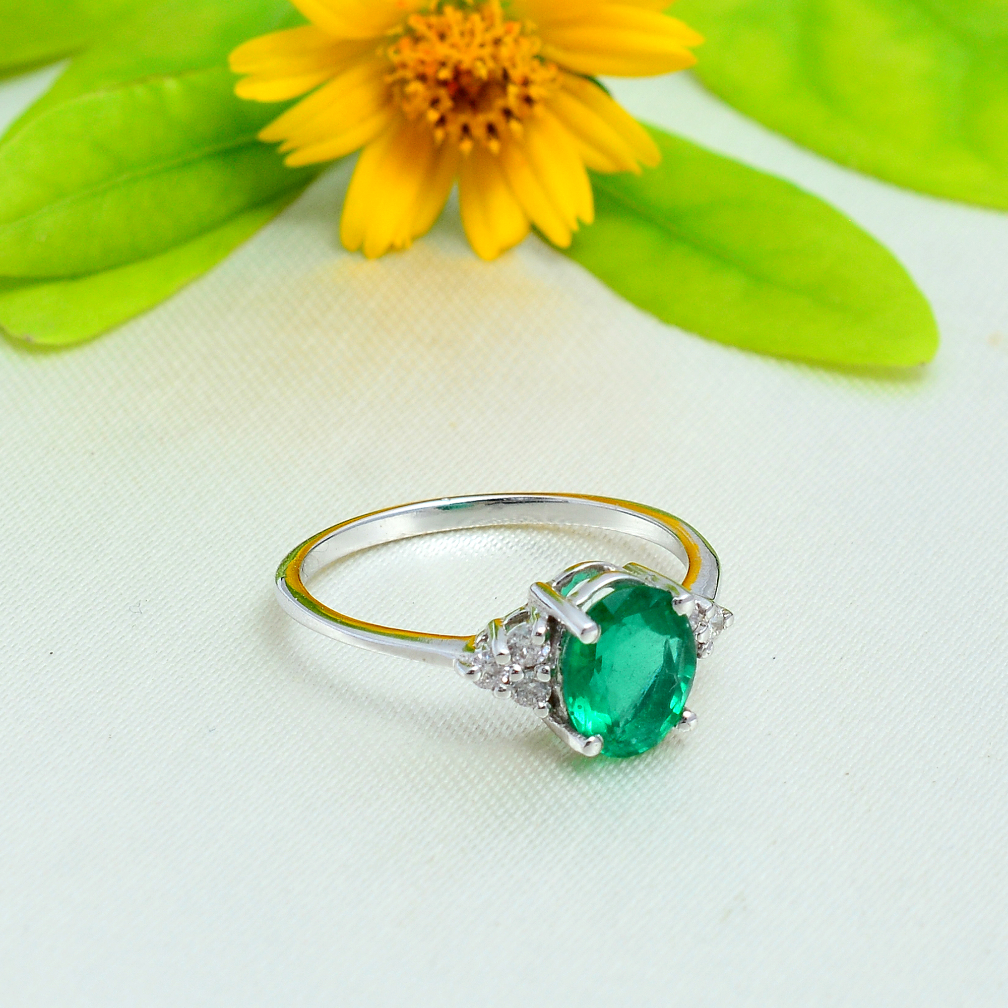 Oval emeralds & diamonds in 18ct white gold