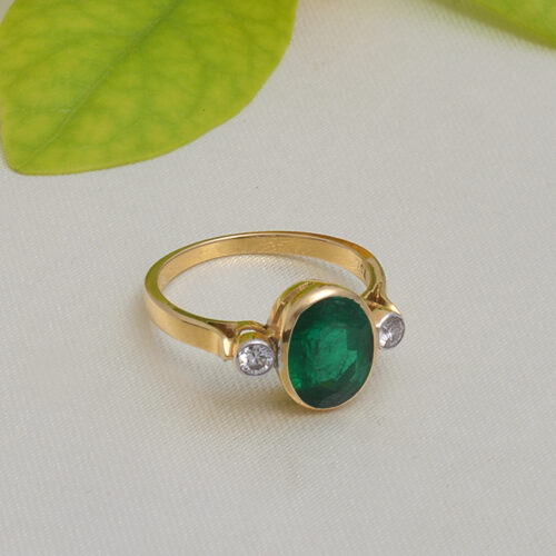 Oval shaped emerald & diamond ring in 18KT yellow gold