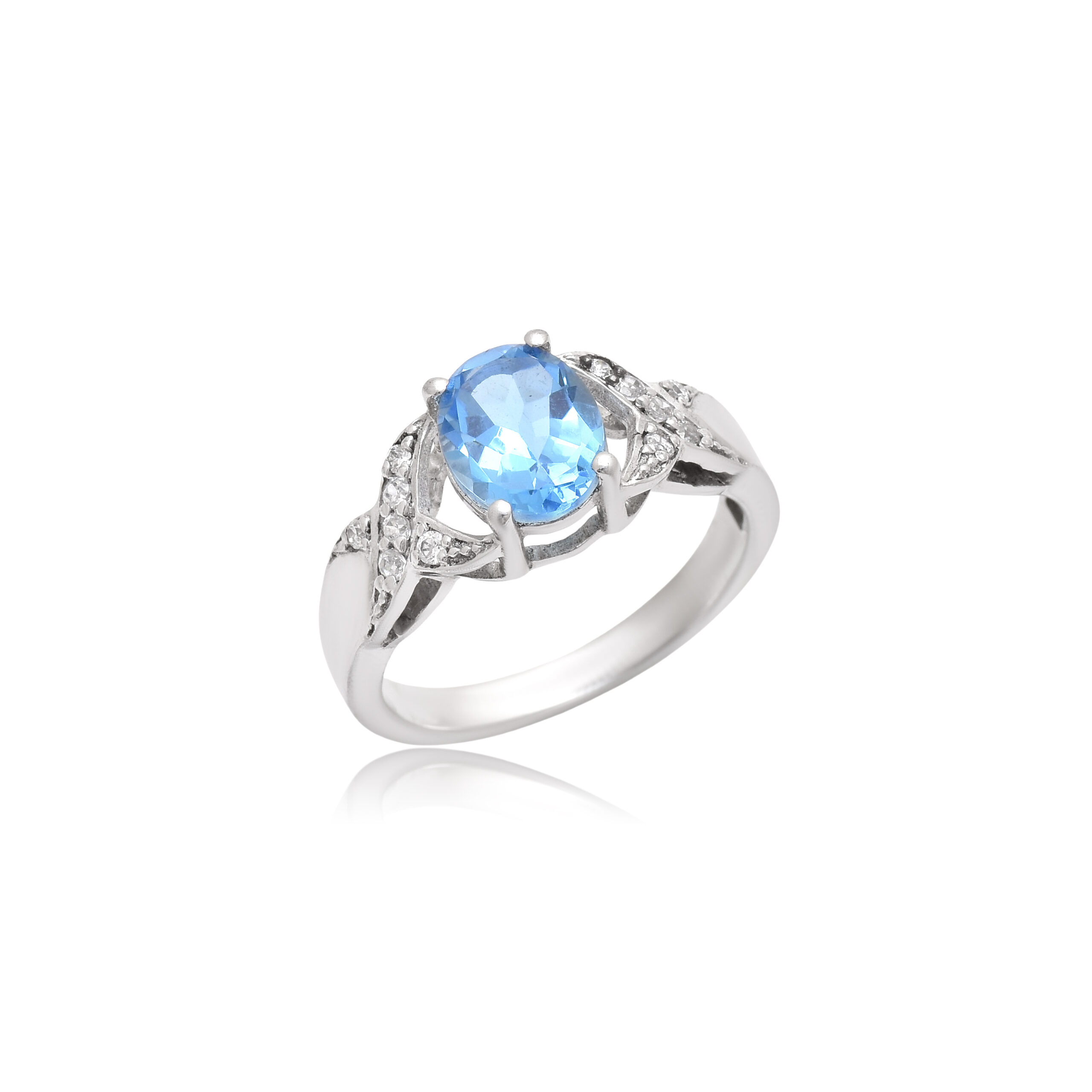 Oval shaped blue topaz and cubic zirconia in silver ring