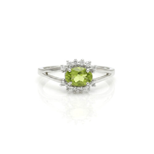 Oval peridot with cubic zirconia in silver ring
