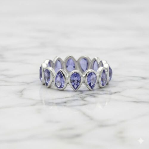 Pear tanzanites bezel ring in silver