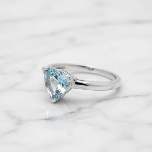 Trillion blue topaz in silver ring