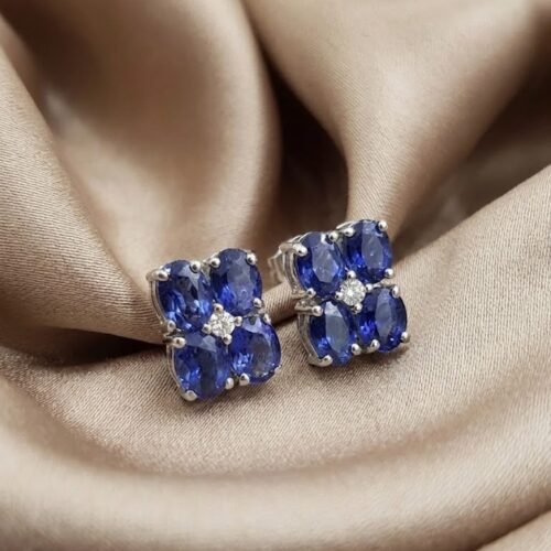 Sterling silver oval blue sapphire diamond cluster earrings